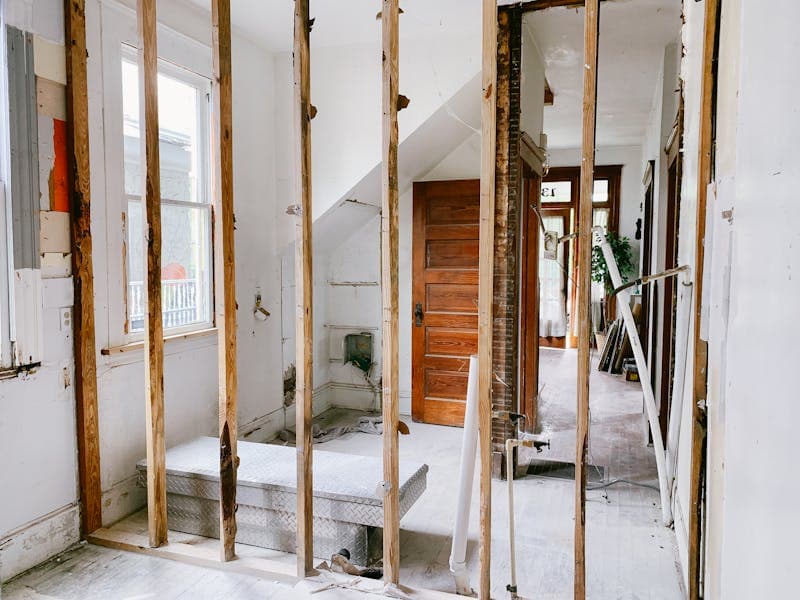 Exposed wood framing during a NYC home reconstruction